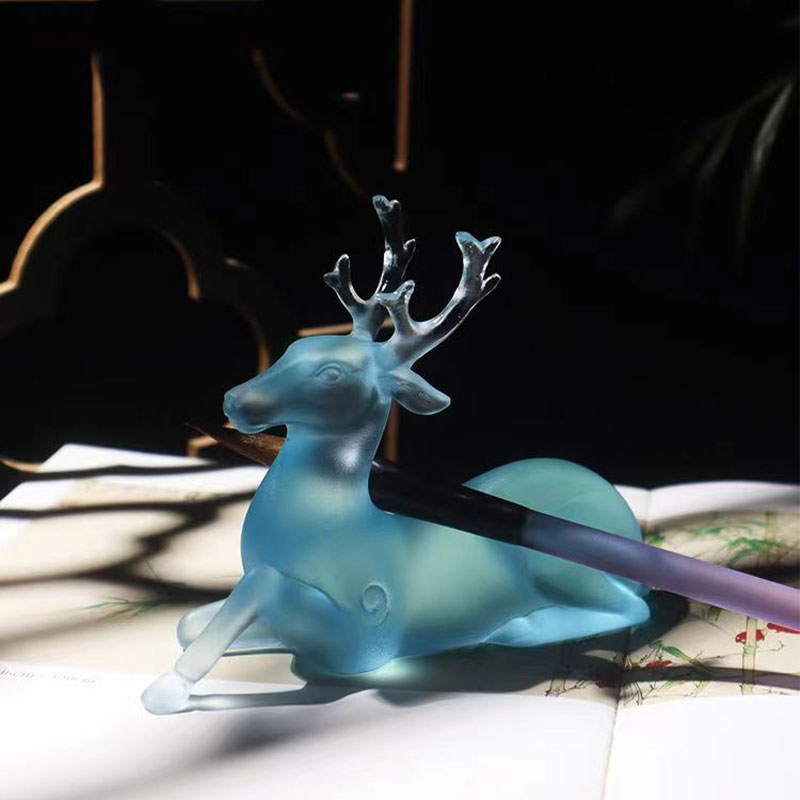 Hjorteformet børsteholder i blåt glas