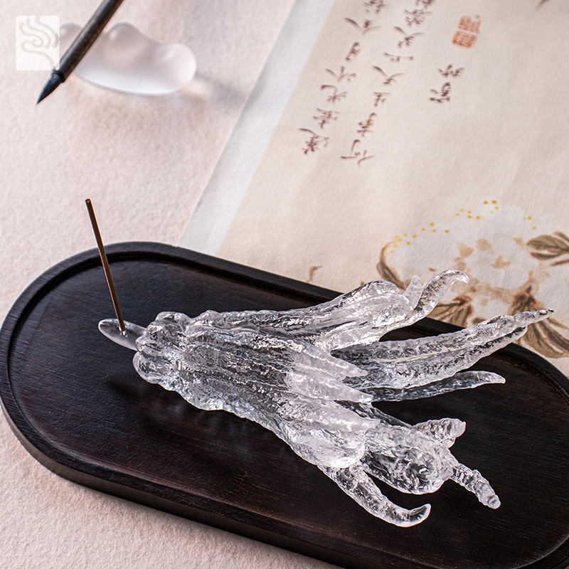 Håndformet røgelsesholder i gyldent glas