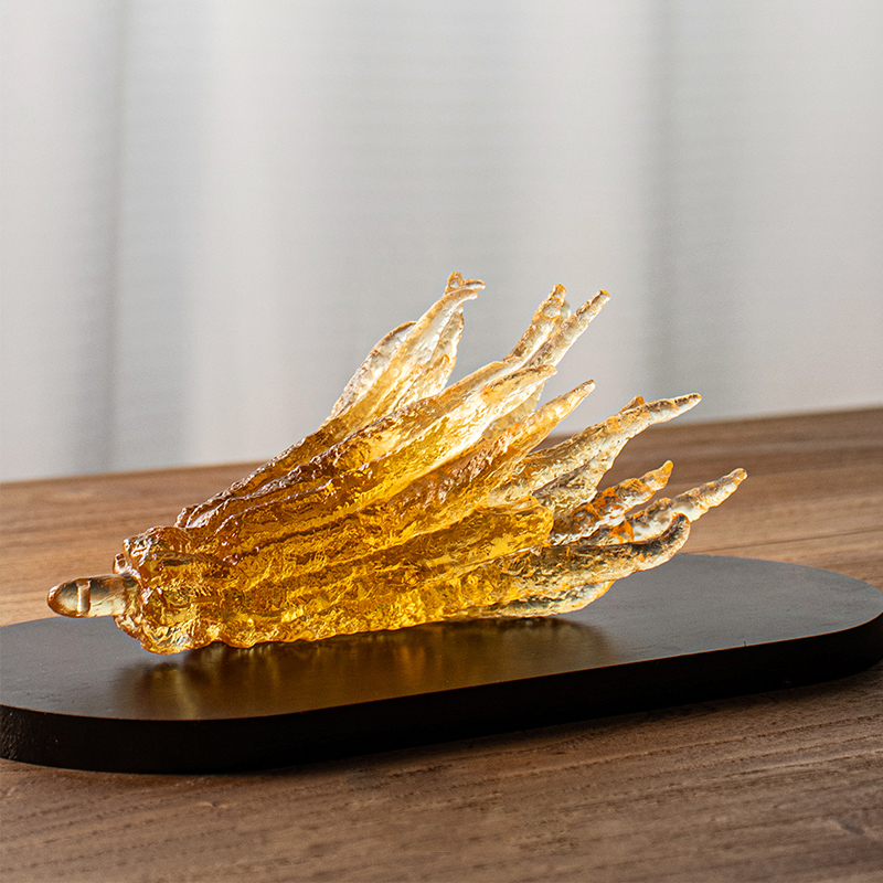 Håndformet røgelsesholder i gyldent glas