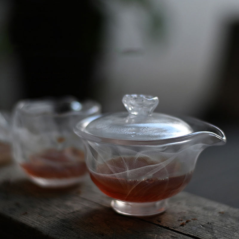 Gennemsigtigt glas tesæt med tekande, tekop