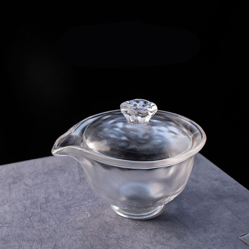 Gennemsigtigt glas tesæt med tekande, tekop