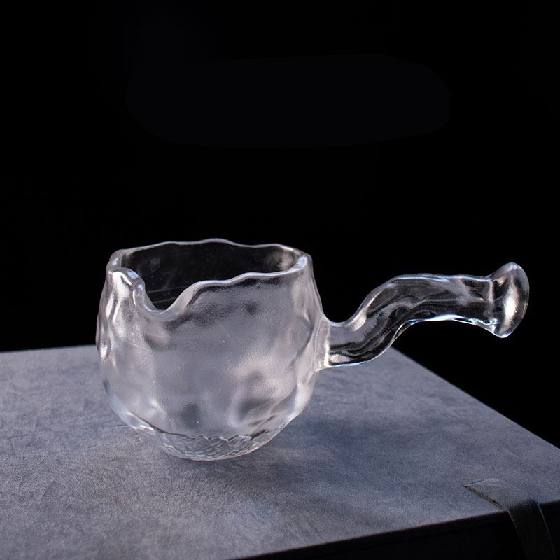 Gennemsigtigt glas tesæt med tekande, tekop